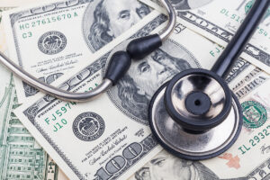 Stethoscope on money background.