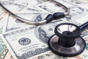 stethoscope on money signifying medical debt