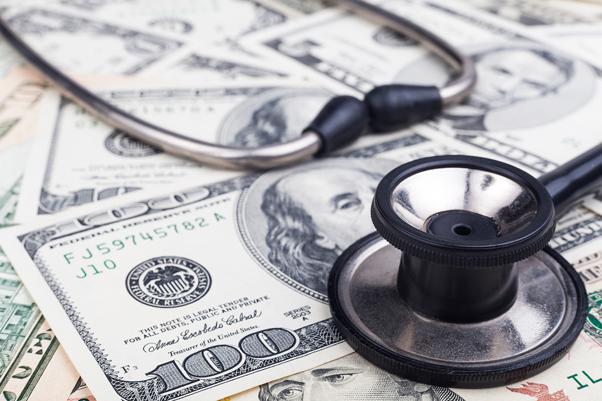 stethoscope on money signifying medical debt